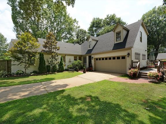 4110 Minden Road Memphis, TN 38117 - Photo 22 of 25 The two car garage is hidden around the back of the house and has a large storage closet that runs along the entire width of the garage.