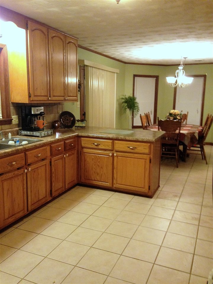 544 Bowers Road Drummonds, TN 38023 - Photo 8 of 21 A view of the kitchen, breakfast bar, & dining area.
