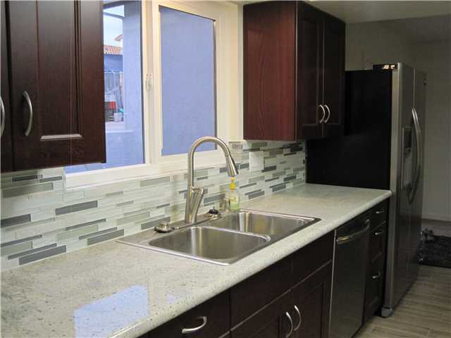 9202 Inverness Road Santee, CA 92071 - Photo 12 of 25 New custom kitchen with granite counters & stainless appliances.