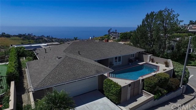 1588 Skyline Drive Laguna Beach, CA 92651 - Photo 4 of 18 Single level, street-to-street corner lot on a cul-de-sac. Steps away from hiking trails. Trolley stop around the corner to take to the beach, restaurants and shopping downtown.
