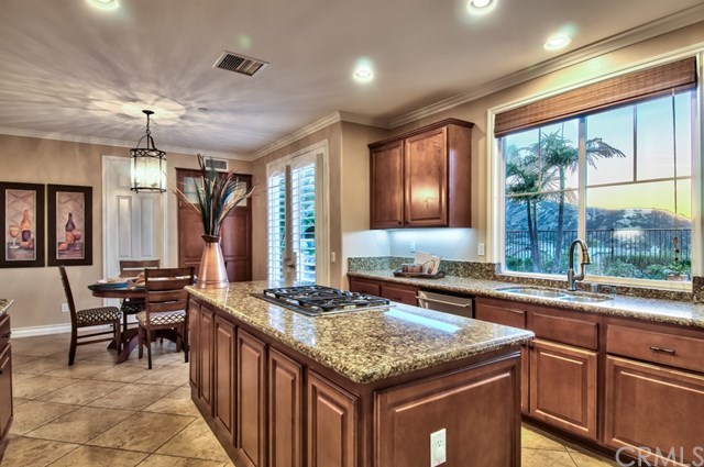 2148 Sageleaf Circle Corona, CA 92882 - Photo 12 of 74 This kitchen also has views, a built-in china hutch and a walk-in pantry.