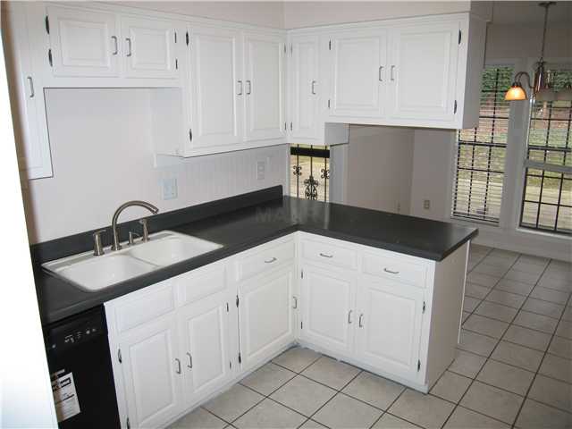 8575 Walnut Grove Road Memphis, TN 38018 - Photo 6 of 12 Nice kitchen with new dishwasher,tile floorsplenty of great cabinet space and nice breakfast area.