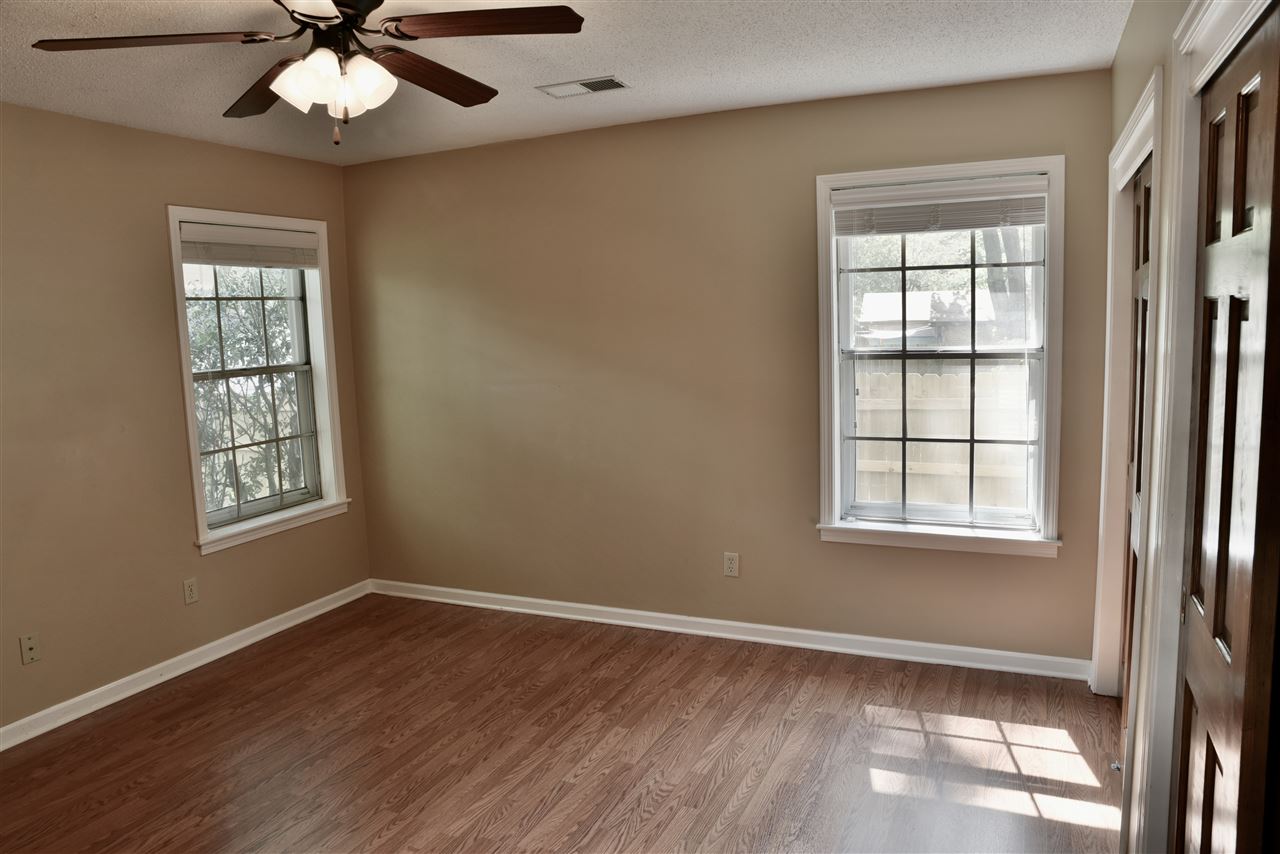 2202 Howard Road Germantown, TN 38138 - Photo 15 of 25 Spacious master bedroom with lots of natural light & private door to the back patio.