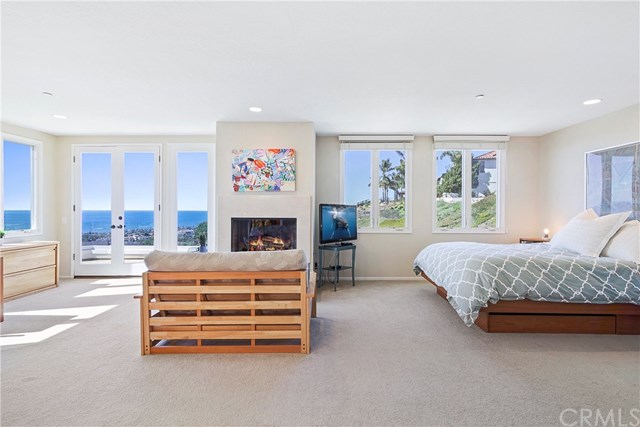 625 Avenida Acapulco San Clemente, CA 92672 - Photo 28 of 48 LARGE MASTER BEDROOM INCLUDES COZY GAS FIREPLACE AND ROOM FOR A HOME OFFICE; ALL WITH THE BEST VIEWS OF THE PACIFIC AND WHITE WATER.