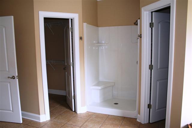 1212 Webb Road Lewisburg, TN 37091 - Photo 14 of 30 MASTER BATH HAS WALK IN DOUBLE SHOWER, HIS/HER CLOSETS AND SEPARTE TUB TO THE RIGHT.