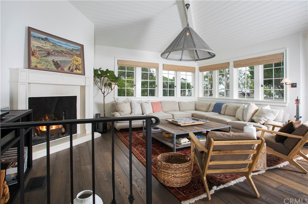 326 Ruby Street Laguna Beach, CA 92651 - Photo 9 of 20 Family Room with Wood Burning/Gas Fireplace and Balcony with Ocean Views.
