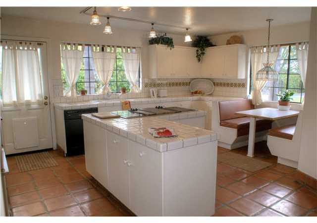 3973 Sleeping Indian Road Fallbrook, CA 92028 - Photo 7 of 25 Light and bright working kitchen with plenty of counter, storage and walk in pantry.