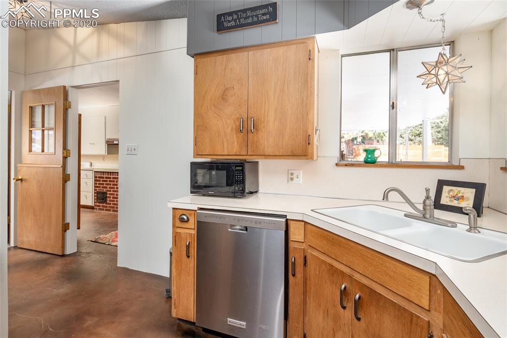 8715 Chipita Park Road Cascade, CO 80809 - Photo 18 of 33 Views from the kitchen of the mud room and hallway to the master bedroom.