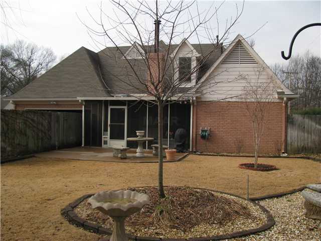 284 Great Falls Road Collierville, TN 38017 - Photo 11 of 11 View from the backyard--two car back load garage, screened in porch and extensive landscaping! You will just need to move in and enjoy!