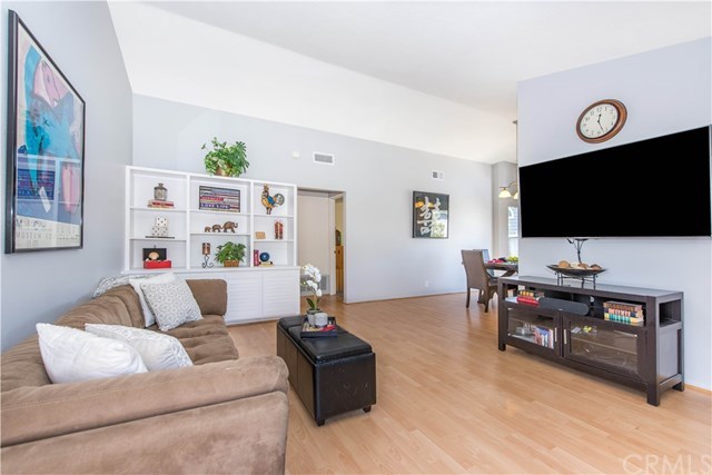 131 Remington, Unit 239 Irvine, CA 92620 - Photo 5 of 36 The built-in cabinet in the living room is perfect for displaying your treasures!