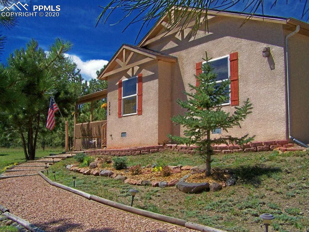 2602 Southpark Road Florissant, CO 80816 - Photo 3 of 25 Charming Architectural Details, Custom Shutters & Landscaping