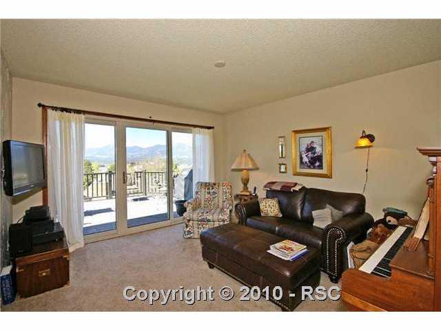 The sitting room has fantastic views to the southwest and its own Accent sliding doors leading to the large back deck and a 32 inch wall mounted flat screen television.