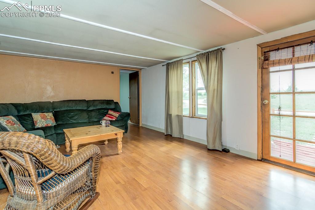 37655 Truckton Road Yoder, CO 80864 - Photo 32 of 35 Large Living Room with great views of Pikes Peak