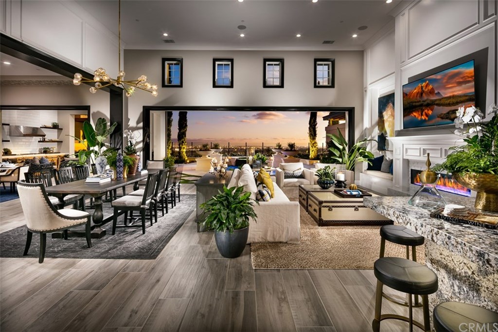 33212 Paseo Celestial San Juan Capistrano, CA 92675 - Photo 2 of 13 Great Room to Dining Room. Photos of similar model home not actual home for sale.