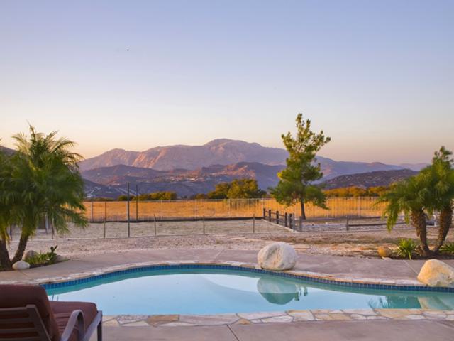 1668 La Force Road Alpine, CA 91901 - Photo 2 of 25 Entertainers delight! This backyard features stamped concrete walkways, a pool with slide, waterfall and attached spa, volley ball court, horse shoe area, tether ball area, built-in BBQ area, fire pit, orchard and simply stunning views!