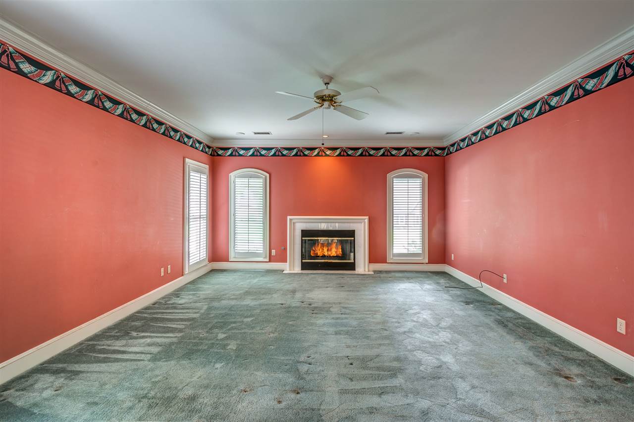 2044 Steeplebrook Drive Memphis, TN 38016 - Photo 13 of 25 Large Room ~ Level 1 ~ Feature Fireplace ~ Carpet ~ Ceiling fan ~ Smooth Ceiling ~ Plantation Shutters