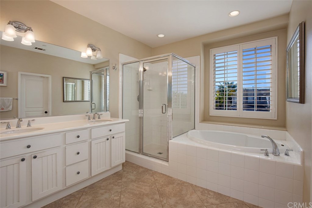 605 Corte Calmo San Clemente, CA 92673 - Photo 14 of 27 Master bathroom with walk-in shower and separate soaking tub.