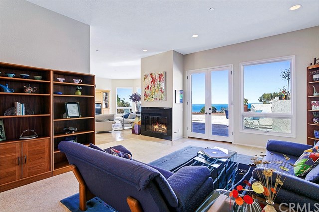 625 Avenida Acapulco San Clemente, CA 92672 - Photo 12 of 48 ANOTHER FAMILY ROOM AREA THAT OPENS UP TO THE OCEAN-VIEW PATIO; GAS FIREPLACE