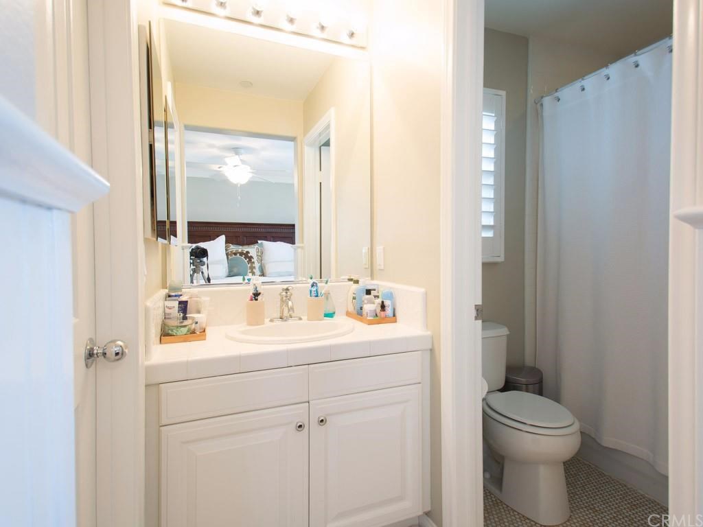 124 White Flower Irvine, CA 92603 - Photo 13 of 26 The 2nd upstairs bath has a shower over the tub and a walk-in closet