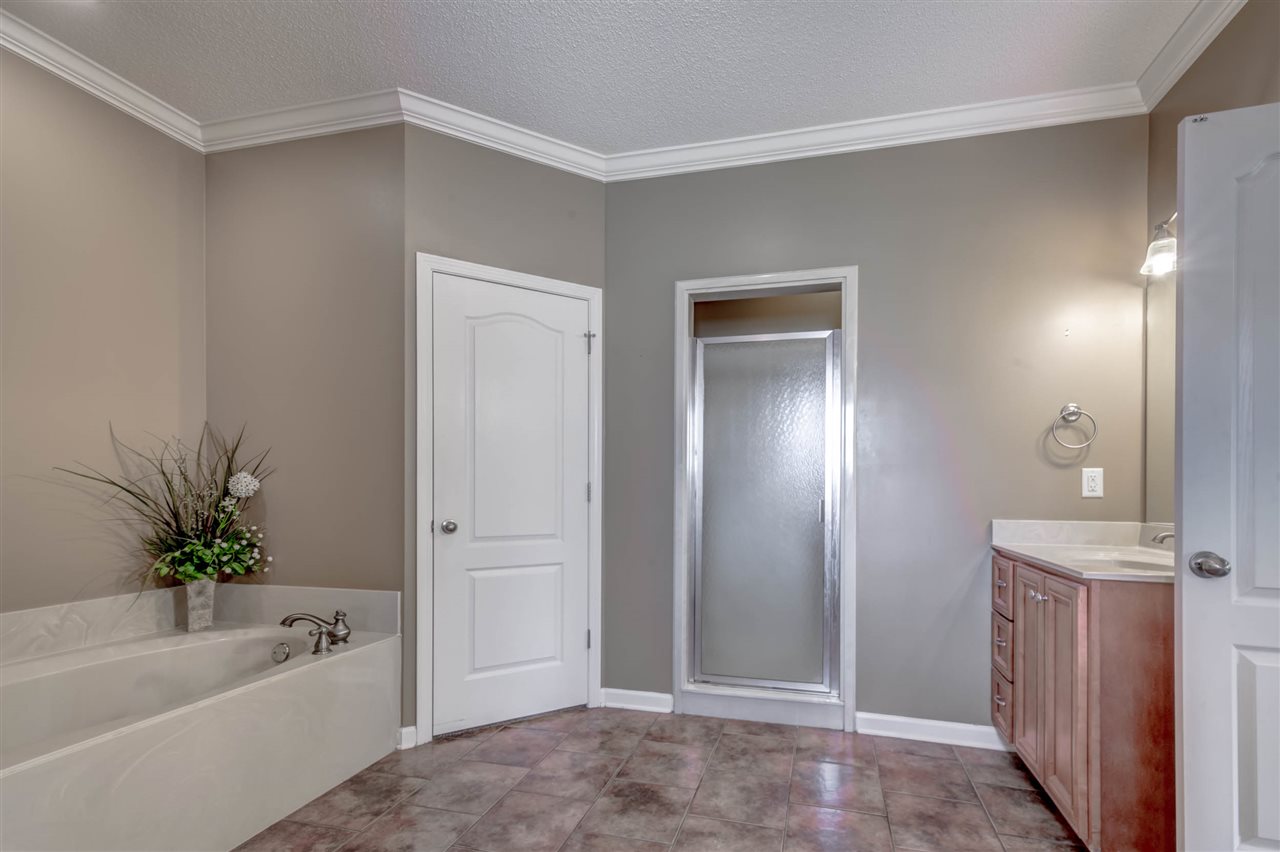 8 Eagle Trace Road Covington, TN 38019 - Photo 13 of 25 Dual Vanity, Whirlpool Bathtub, Separate Shower, Walk-In Closet, Tile Floor, Crown Molding.