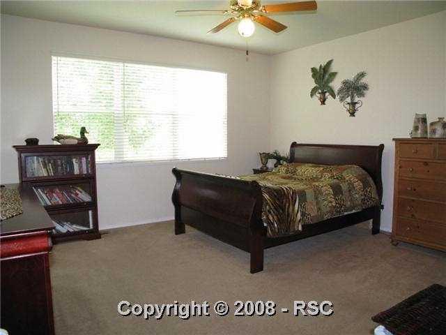 5331 Rondo Way Colorado Springs, CO 80911 - Photo 7 of 16 Master Bedroom with private bathroom and accessto sunroom