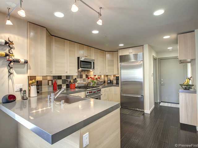 844 3rd Street Encinitas, CA 92024 - Photo 10 of 25 Exquisite designer kitchen with its Caesarstone countertops, maple cabinetry, Wolf, Bosch and Subzero applicances!!