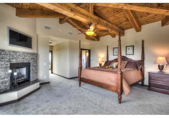 1246 Rancho Luiseno Road Escondido, CA 92026 - Photo 11 of 25 Private master suite, upstairs, with 360 degree views, large walk-in closet, fireplace, balcony, and office/den