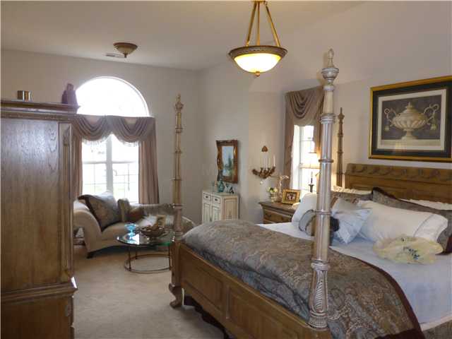4940 Misty River Road Bartlett, TN 38135 - Photo 11 of 20 What a beautiful space! Large downstairs master with a palladium window, room for a king-sized bed as well as a sitting area. More updated fixtures and attractive window treatments.
