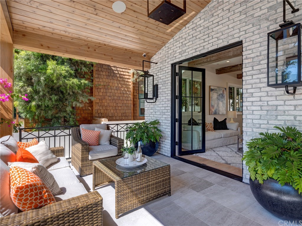 559 31st Street Manhattan Beach, CA 90266 - Photo 2 of 49 Front porch - Solara natural gas porch lamps, LaCantina door systems, surround sound on porch, sandblasted marble entry tiling, dutch door, security cameras.