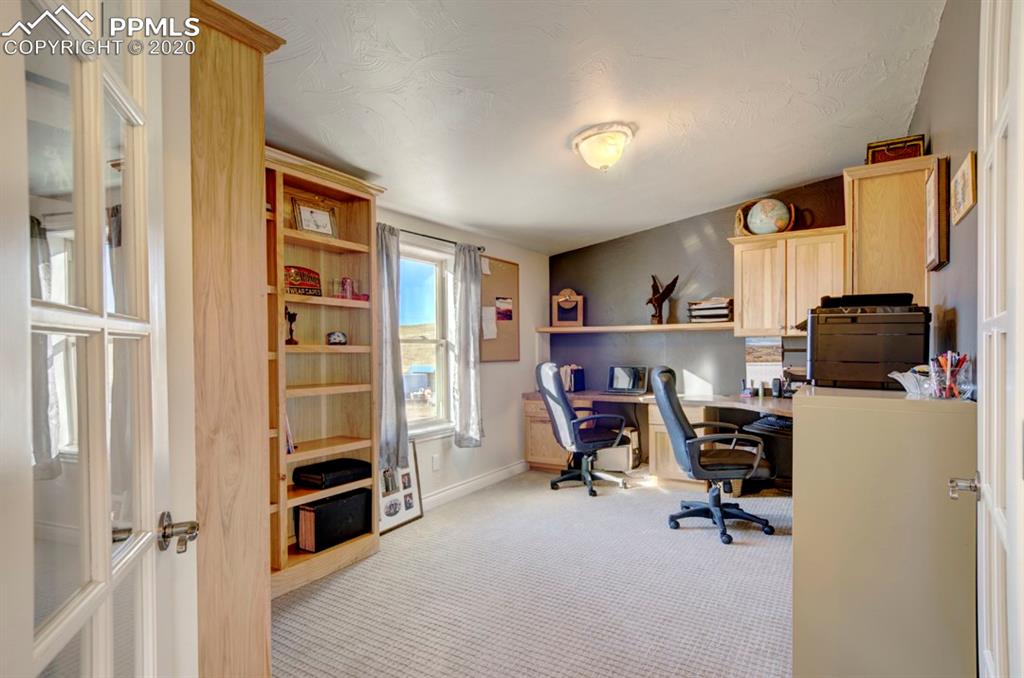 3235 South Meridian Road Colorado Springs, CO 80929 - Photo 21 of 36 5th room being used as a study but can be used as a bedroom as well. NEW carpet!