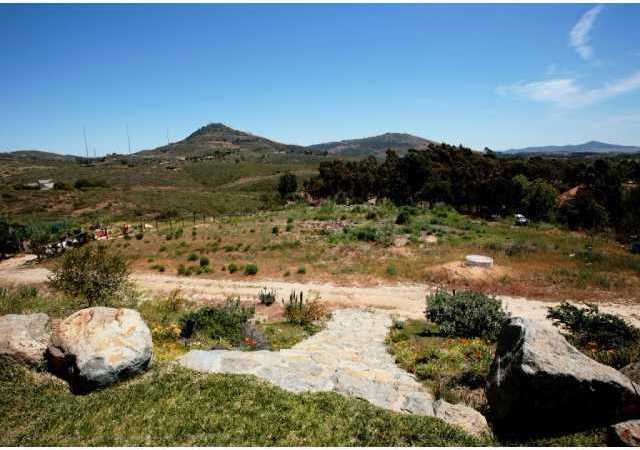 3420 Adams Run Encinitas, CA 92024 - Photo 4 of 25 Custom stone steps leading to acre of undeveloped, usable land backing up to open protected space. Land perfect for horse facilities and/or tennis court.