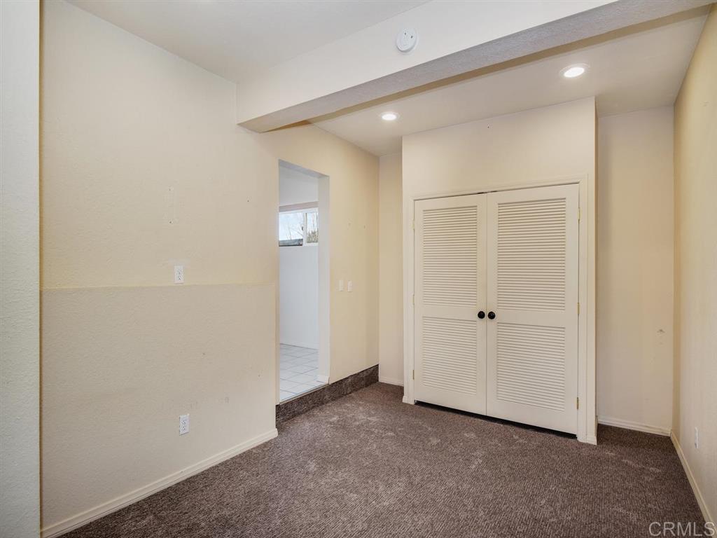 869 Beryl Street San Diego, CA 92109 - Photo 19 of 25 One bay of the 3 car garage is currently used as bonus space with a removable kitchenette and 3/4 bath