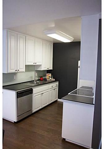 401 Requeza Street, Unit F4 Encinitas, CA 92024 - Photo 4 of 19 Nice kitchen with bright white cabinets and designer back splash.