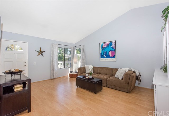 131 Remington, Unit 239 Irvine, CA 92620 - Photo 7 of 36 Enjoy vaulted ceilings in the livingroom!