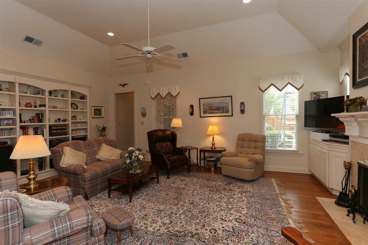 1465 Wolf Bend Road Germantown, TN 38138 - Photo 9 of 25 Very large Den (26x16)! Enjoy reading, watching tv, entertaining, or relaxing by the fire in this warm and inviting family room, complete with built in bookshelves and a remote controlled fireplace!