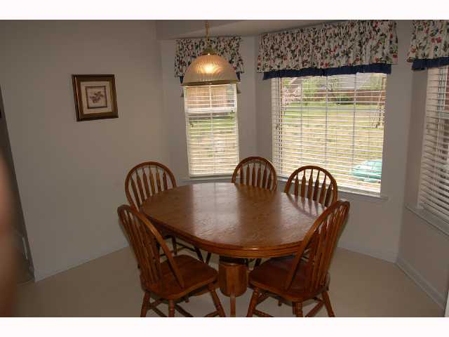 Sunny breakfast room overlooks huge backyard. spotless!