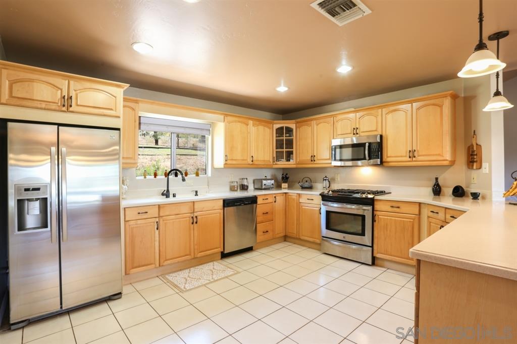 18921 Highway 94 Dulzura, CA 91917 - Photo 9 of 25 Plenty of room to create in this beautiful, well-equipped kitchen with a large walk-in pantry