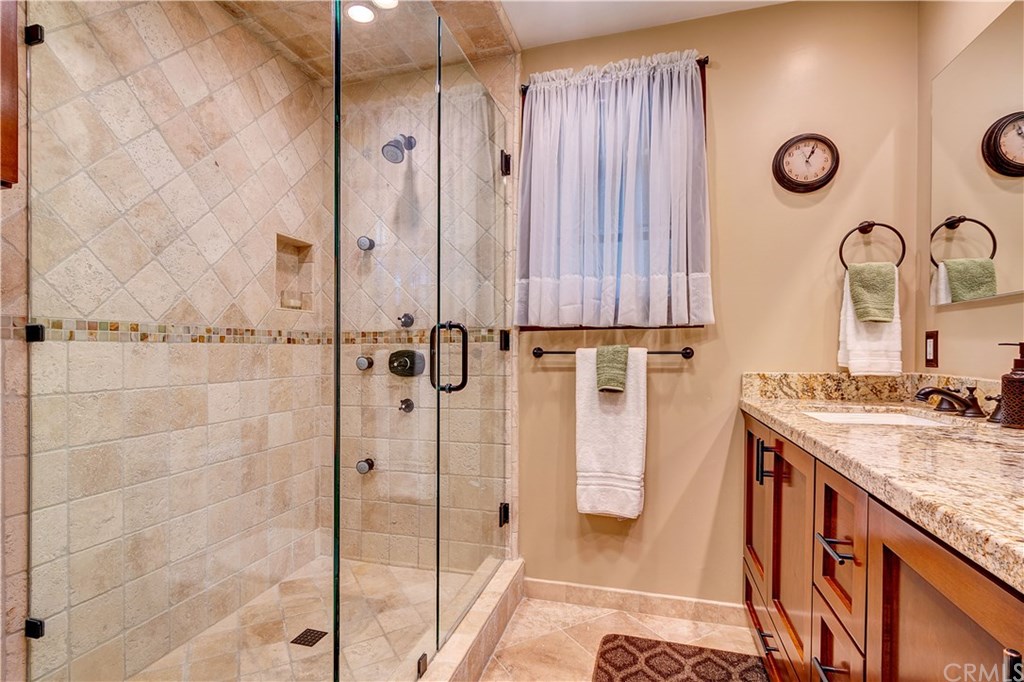 13719 Philadelphia Street Whittier, CA 90601 - Photo 23 of 45 Master bathroom with walk-in shower and glass enclosure