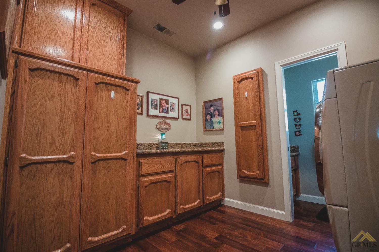 3800 South Sterling Road Bakersfield, CA 93307 - Photo 12 of 31 Laundry Room & Half Bathroom