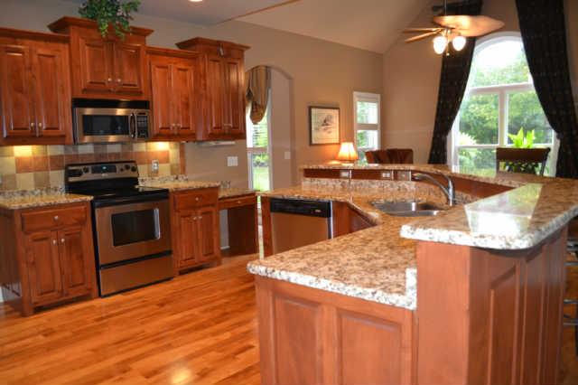 219 Ridgewater Way Mount Juliet, TN 37122 - Photo 5 of 30 14 X 14 EAT IN KITCHEN WITH KEEPING ROOM, HARDWOOD, GRANITE, CUSTOM CABINETS & BAR