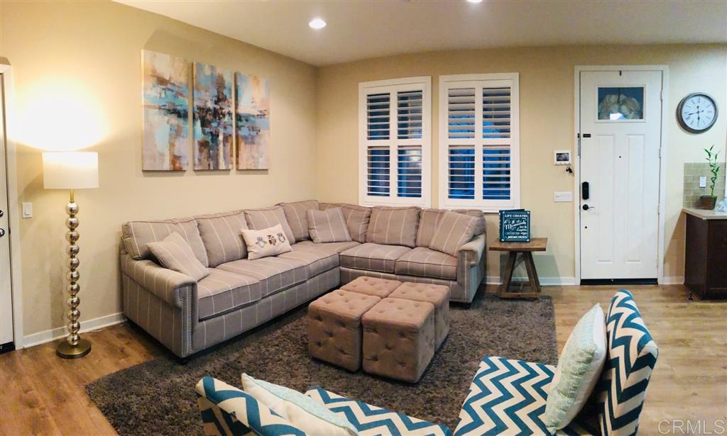 17 Alzada Street Rancho Mission Viejo, CA 92694 - Photo 8 of 20 Family room open to kitchen complete with plantation shutters and recessed lighting
