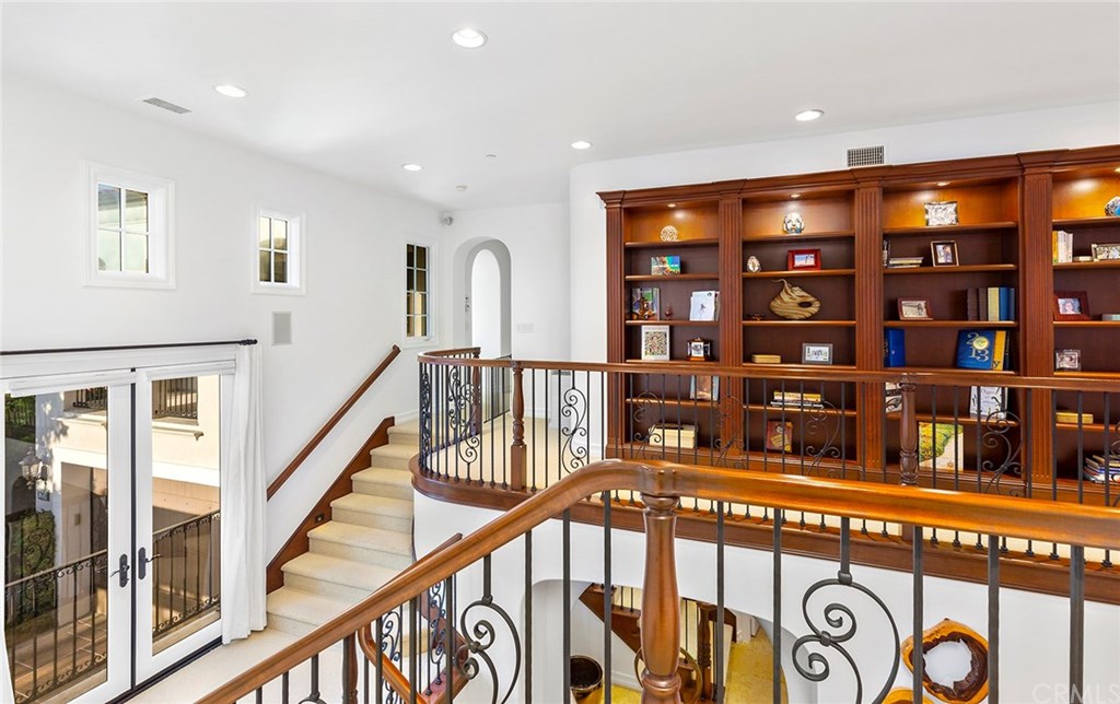 20 Highpoint Irvine, CA 92603 - Photo 26 of 65 Top of stairs toward master featuring a library