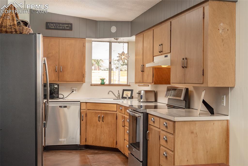 8715 Chipita Park Road Cascade, CO 80809 - Photo 17 of 33 Clean, practical kitchen with updated stainless steel appliances.