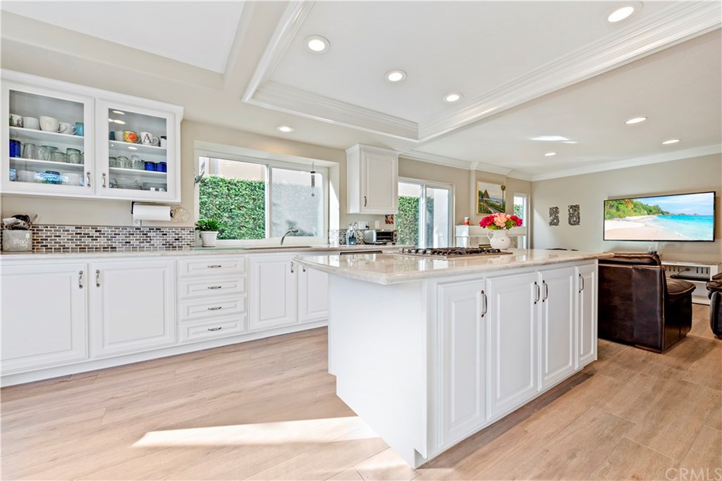 2152 Vallejo Drive Tustin, CA 92782 - Photo 11 of 35 Gorgeous remodeled kitchen with stone counters, updated cabinets, flooring, recessed lighten, SS appliances, and so much more.