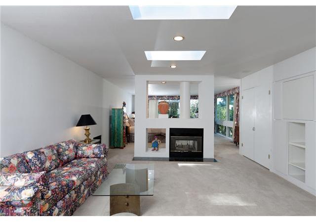 2545 Ardath Road La Jolla, CA 92037 - Photo 16 of 25 Expansive master suite includes a large sitting room with a 2-sided fireplace