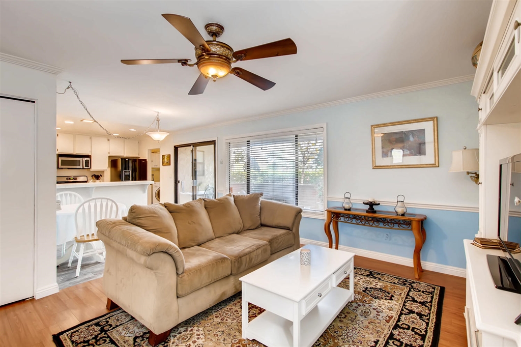 8434 Summerdale Road, Unit A San Diego, CA 92126 - Photo 5 of 25 Living room with view into dining area and kitchen