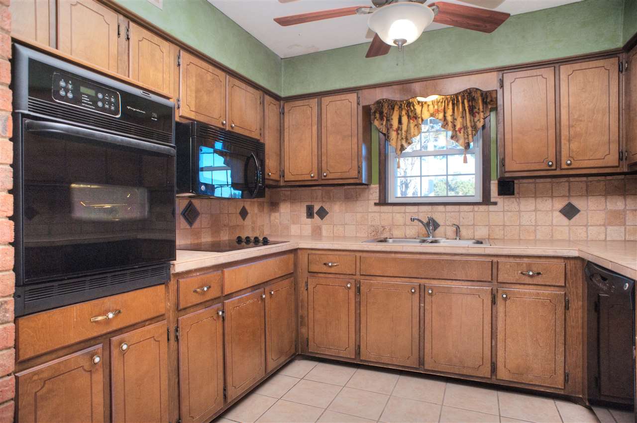 8380 Donnell Road Millington, TN 38053 - Photo 6 of 22 Kitchen features Tile Floor, Custom Tile Counters and Backsplash, and Appliances Included