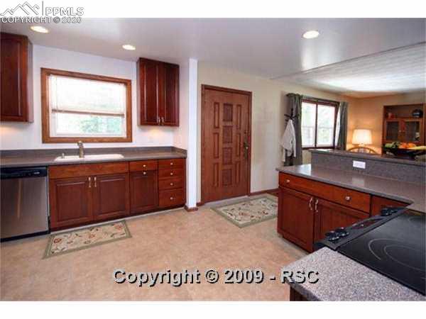 7835 Cyprus Road Colorado Springs, CO 80908 - Photo 5 of 16 Kitchen Looking Toward Home Entry