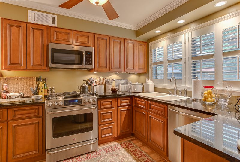 5323 Mason Road Memphis, TN 38120 - Photo 10 of 25 This view of the updated kitchen shows off so much of the care that has been put into the home. Note the newer cabinetry, granite counter tops, fantastic sink, dental crown molding, plantation shutters, newer flooring, and gas cooking!