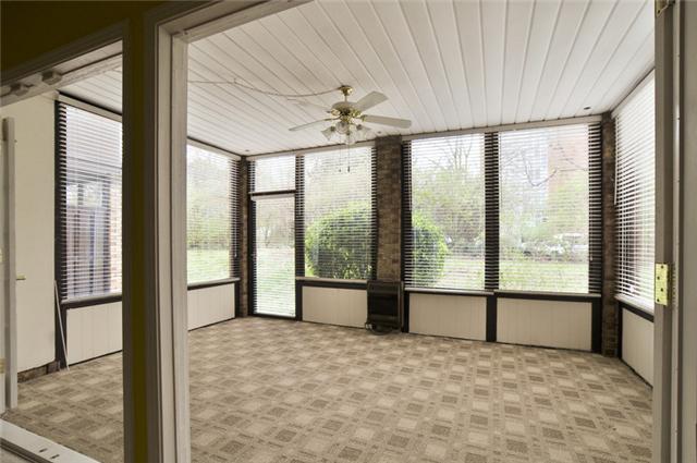 4505 Harding Pike, Unit 106 Nashville, TN 37205 - Photo 11 of 13 Open those French doors and step out into the light-filled sun-room.